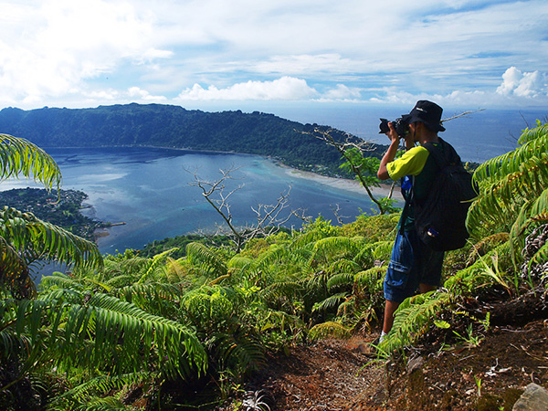 Ihsan taking photos from the top of Gunung Api...